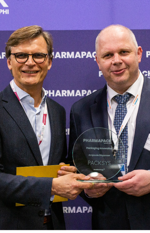 Two pharma professionals holding Pharmapack award