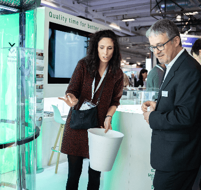 pharma professional showcasing product at Pharmapack event